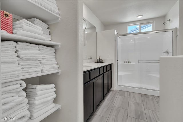 bathroom with vanity and an enclosed shower