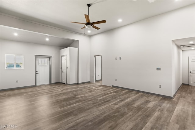 interior space featuring ceiling fan and dark hardwood / wood-style flooring