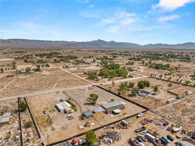 birds eye view of property featuring a mountain view