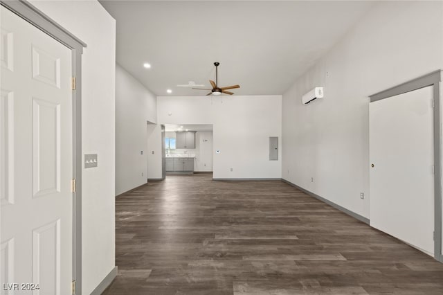 unfurnished living room featuring dark hardwood / wood-style flooring, electric panel, and ceiling fan