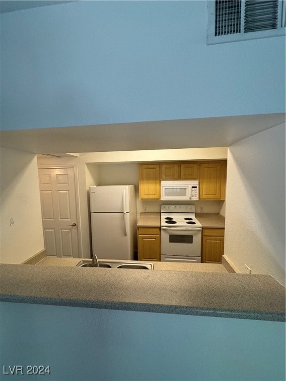 kitchen featuring white appliances