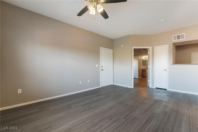 unfurnished room with ceiling fan and dark hardwood / wood-style flooring