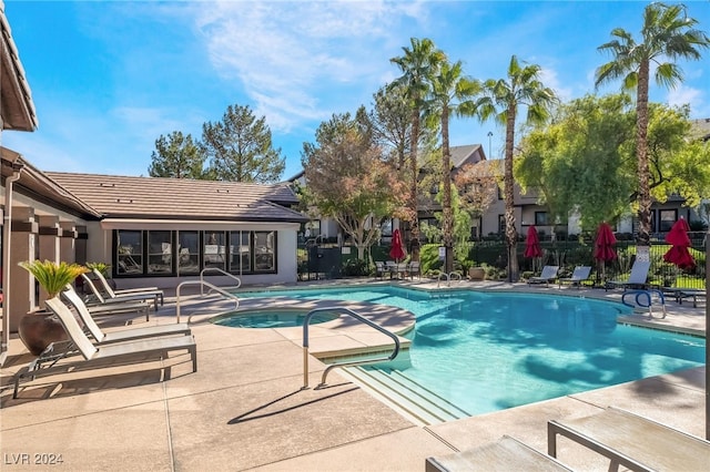 view of swimming pool featuring a patio