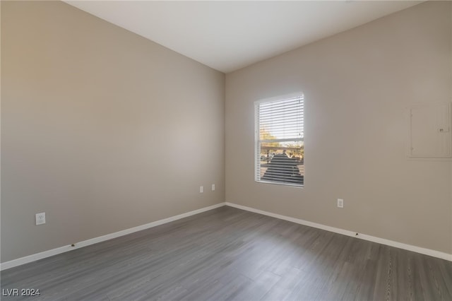 spare room featuring dark hardwood / wood-style flooring