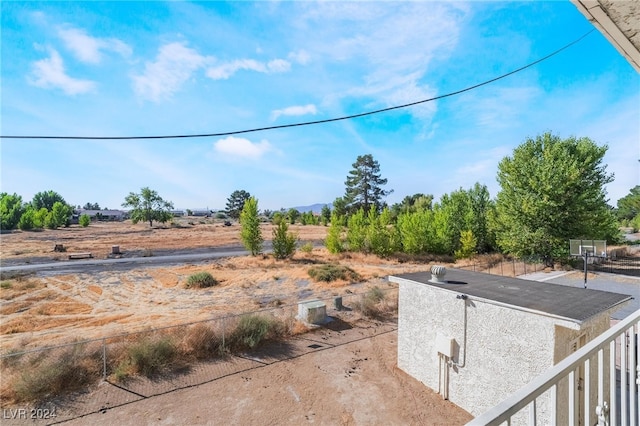 view of yard with a rural view