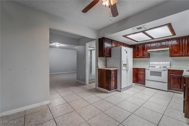 kitchen with ceiling fan, a textured ceiling, light tile patterned floors, and white appliances