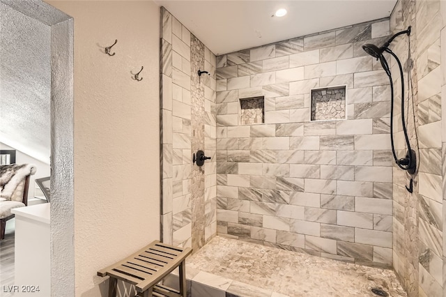 bathroom featuring a tile shower