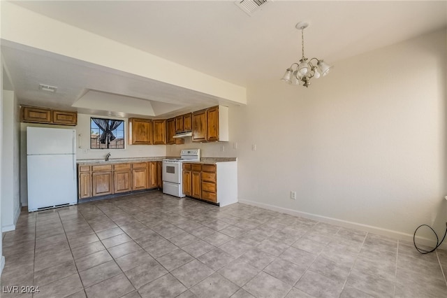 kitchen featuring hanging light fixtures, white appliances, an inviting chandelier, and light tile patterned floors