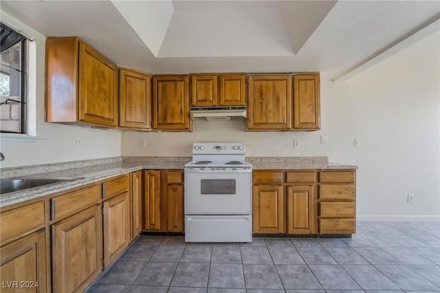 kitchen featuring white electric range, lofted ceiling, sink, and tile patterned floors