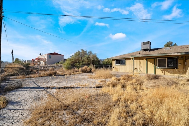 view of yard featuring central air condition unit