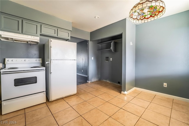 kitchen with pendant lighting, green cabinets, light tile patterned floors, and white appliances