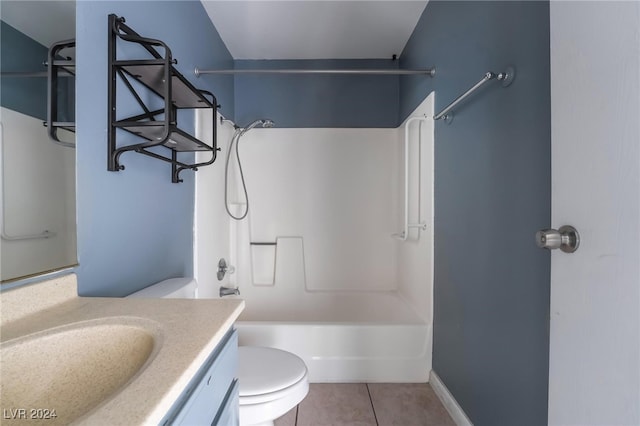 full bathroom featuring toilet, vanity, tile patterned floors, and tub / shower combination