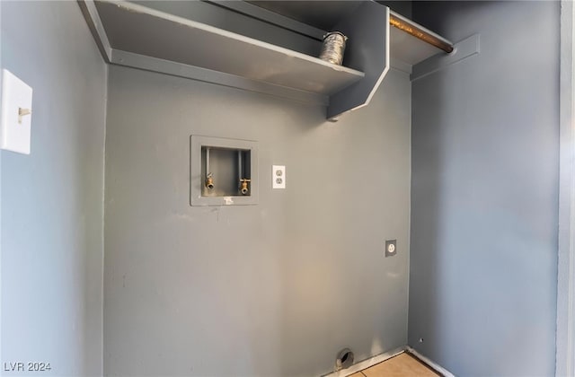 washroom with electric dryer hookup, hookup for a washing machine, and light tile patterned flooring