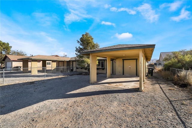 rear view of property featuring a carport