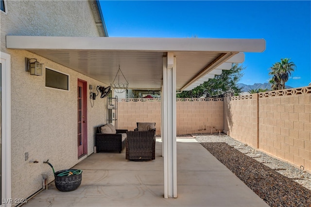 view of patio / terrace featuring a mountain view