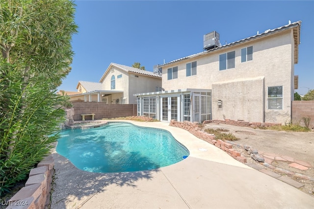 view of swimming pool with central AC and a patio