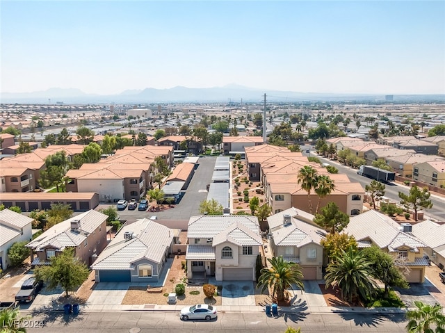 birds eye view of property with a mountain view