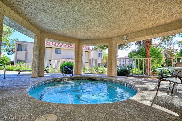 view of swimming pool with a patio