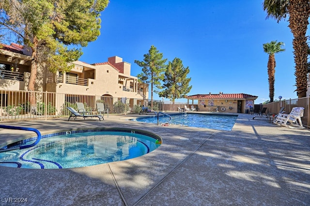 view of swimming pool featuring a patio area