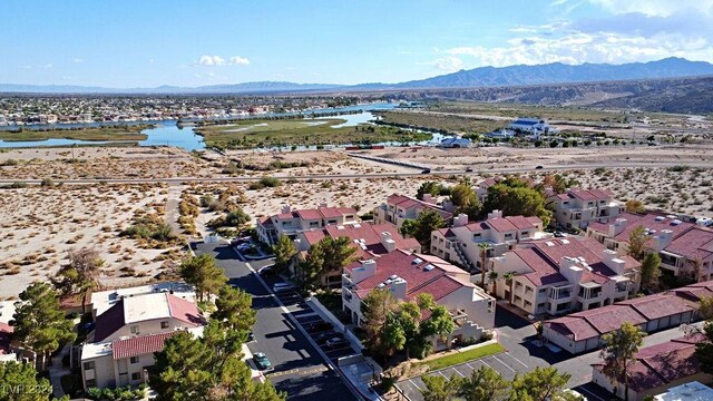 bird's eye view with a water and mountain view