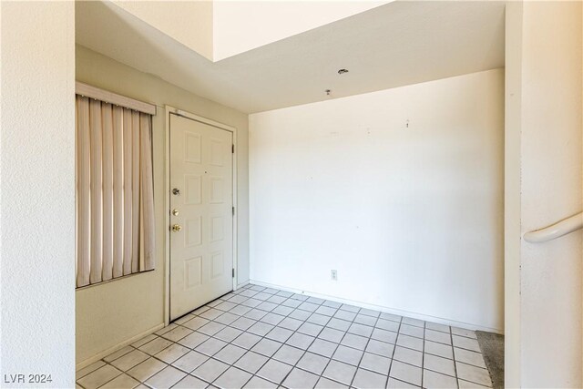 unfurnished room with light tile patterned floors