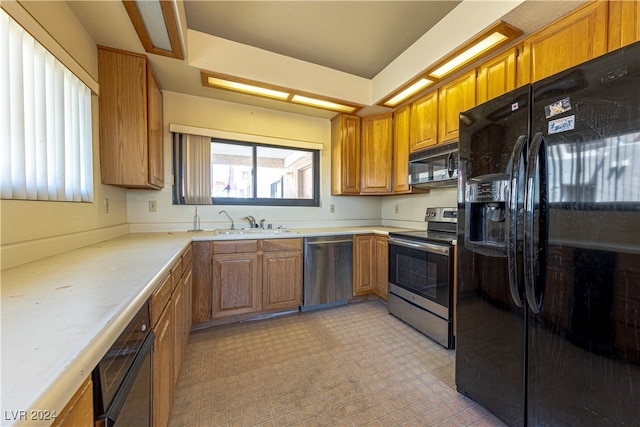 kitchen featuring black appliances and sink