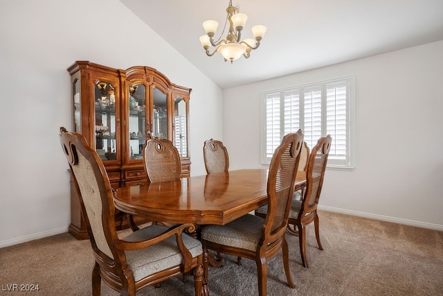 carpeted dining space with lofted ceiling and an inviting chandelier