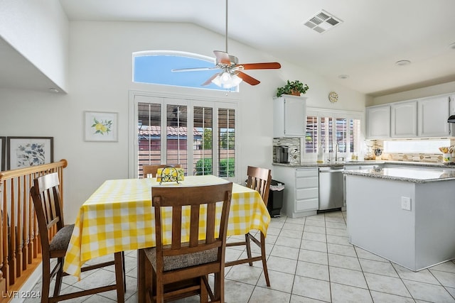 interior space featuring white cabinetry, tasteful backsplash, ceiling fan, stainless steel dishwasher, and light tile patterned flooring