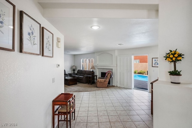 living room with a healthy amount of sunlight and light tile patterned floors