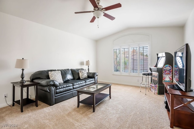 carpeted living room featuring vaulted ceiling and ceiling fan