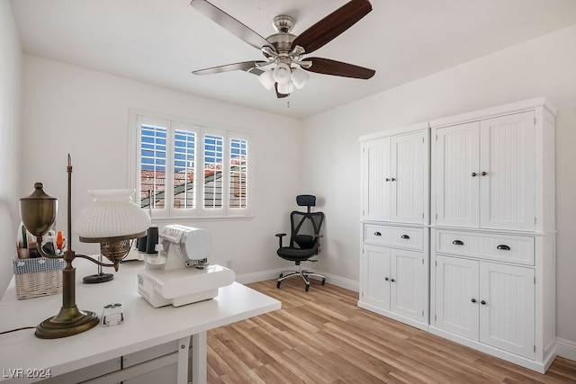 office space with ceiling fan and light hardwood / wood-style flooring