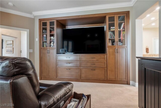 living room with ornamental molding and light carpet