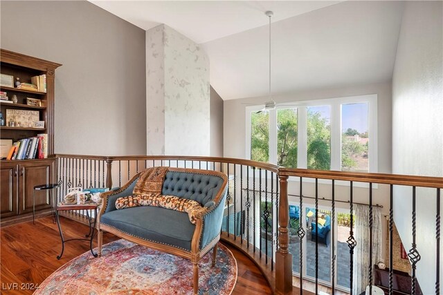 living area featuring hardwood / wood-style floors and lofted ceiling