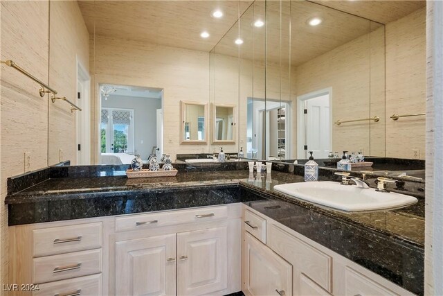 bathroom with ceiling fan and vanity