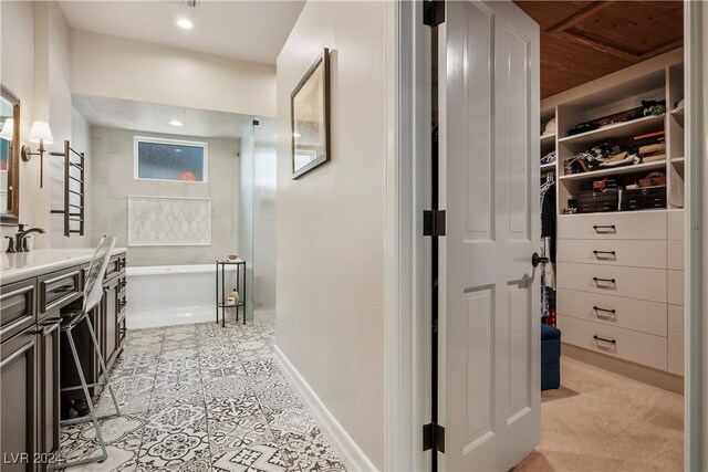 bathroom featuring a tub and vanity