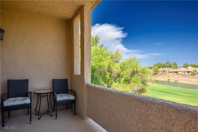 balcony featuring a water view