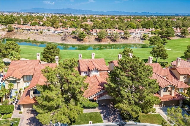 birds eye view of property with a water and mountain view