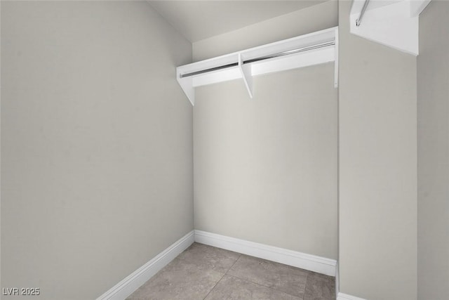 walk in closet featuring light tile patterned floors