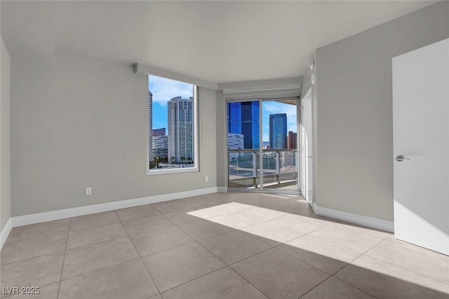 spare room featuring light tile patterned floors