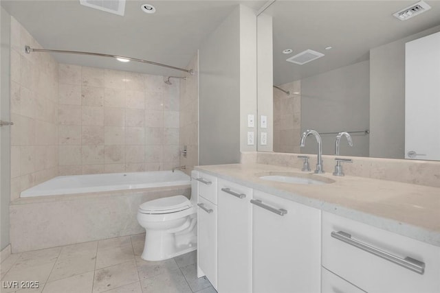 full bathroom with tile patterned floors, toilet, vanity, and tiled shower / bath