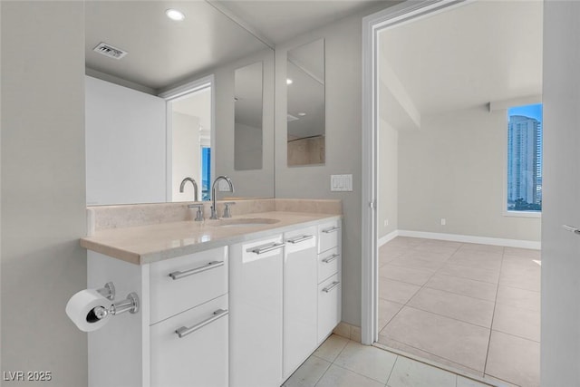 bathroom featuring tile patterned flooring and vanity