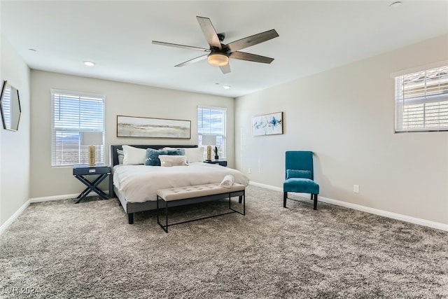 bedroom featuring ceiling fan and carpet