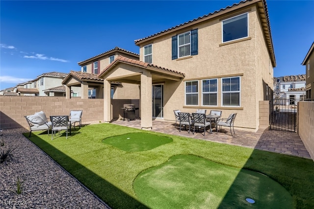 back of house with a patio area