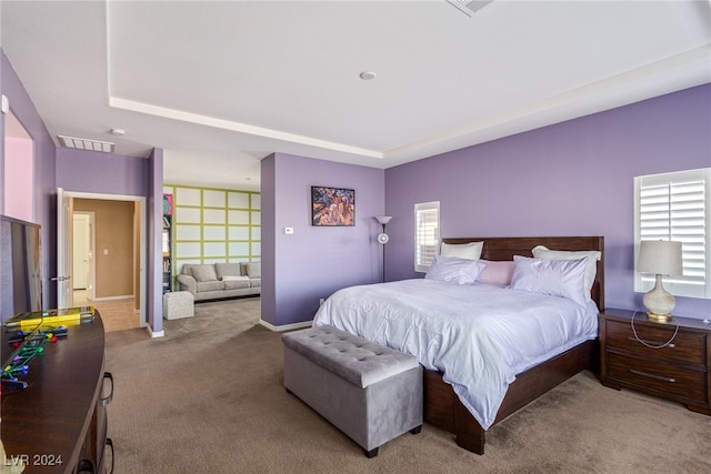 bedroom with light colored carpet