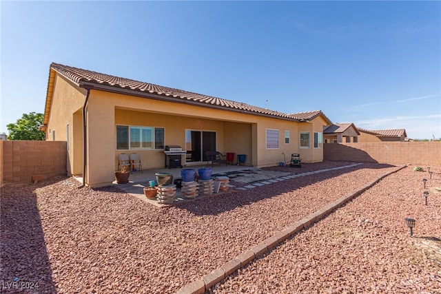 rear view of house with a patio area