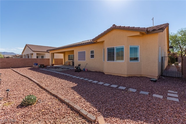 back of property with a patio area