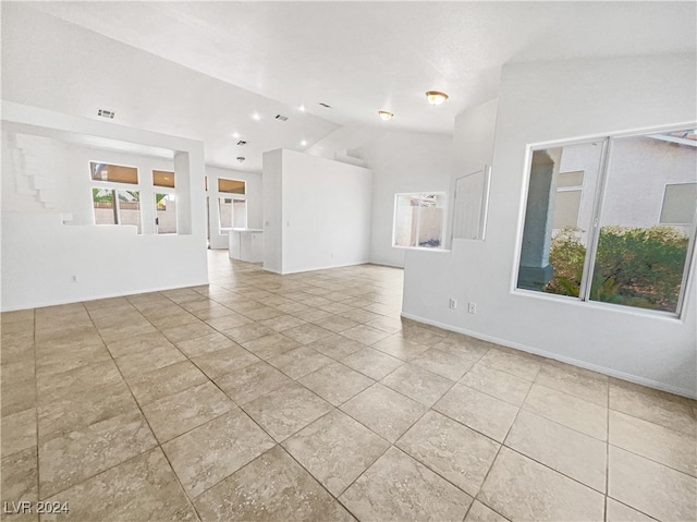 unfurnished living room with light tile patterned flooring