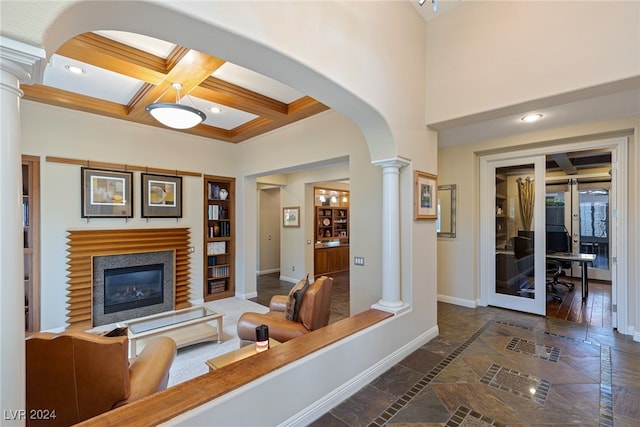 living room with a fireplace, beamed ceiling, dark hardwood / wood-style floors, and coffered ceiling