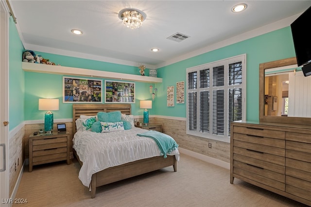 bedroom featuring a chandelier and light carpet