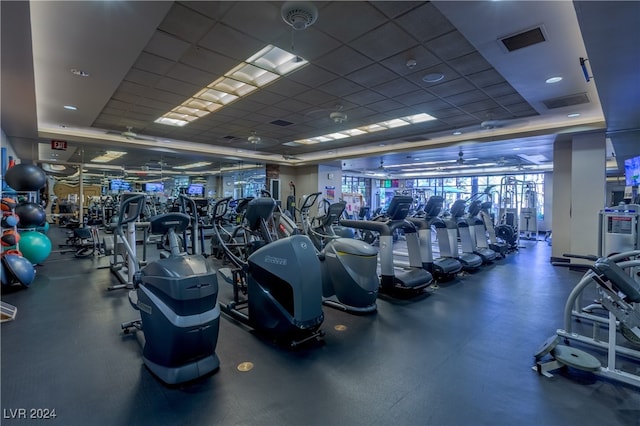 workout area featuring a paneled ceiling